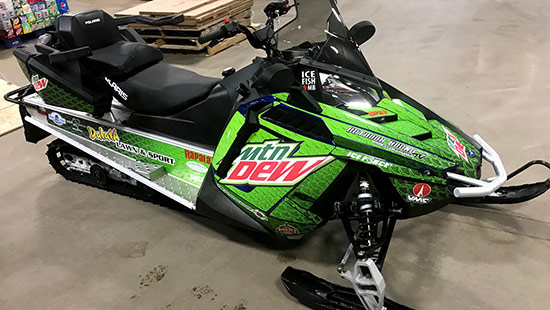 Mountain Dew and Outdoor Bound TV themed Polaris snowmobile