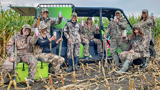 The Outdoor Bound Goose Hunting Team posting in camoflauge with rifles and Bubbl'r beverages with the Mountain Dew UTV
