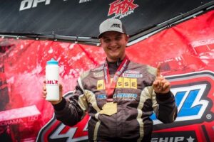 Michael-Meister-First-Place Michael Meister holds Bubbl'r bottle has first place medal around neck