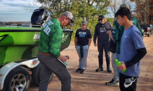 2022_FishingWinner_3 Fishing pro from the Take A Kid Fishing Contest signs autographs for all the young winners