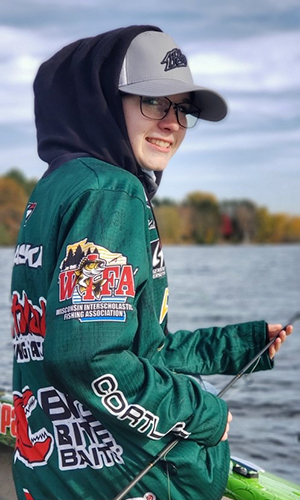 A smiling side photo of the Winner of the Take A Kid Fishing contest