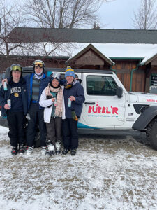 Granite-Peak-Bubblr-Tasting-11 Granite Peak Bubblr Tasting holding cans in front of Jeep