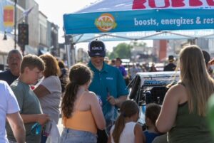 Antigo-Race-Bubblr-IMG_5813 Michael Meister wearing Bubblr hat signs autographs for fans