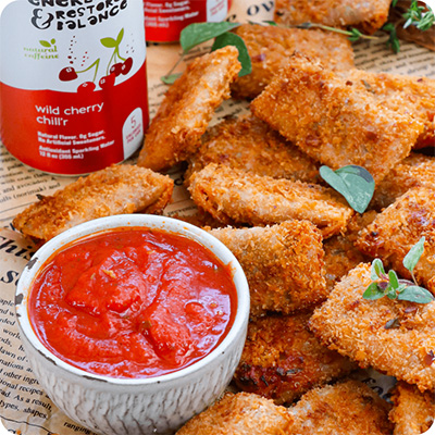 a can of wild cherry chill'r next to a plate of oven-baked crispy pizza roll-up bites and marinara sauce